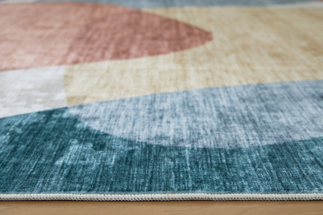 Chanleigh Washable 5' x 7' Area Rug - Inland Furniture (San Bernardino, CA)