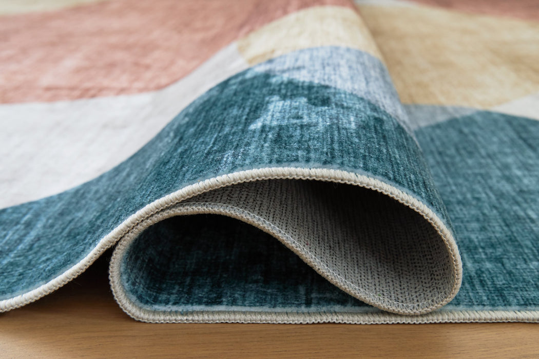 Chanleigh Washable 5' x 7' Area Rug - Inland Furniture (San Bernardino, CA)